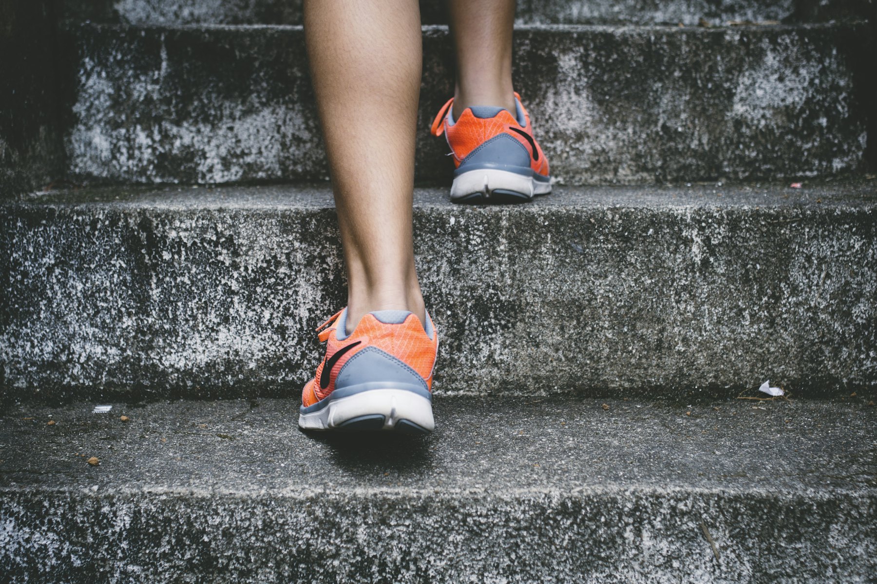 Runner sprinting up a flight of stairs